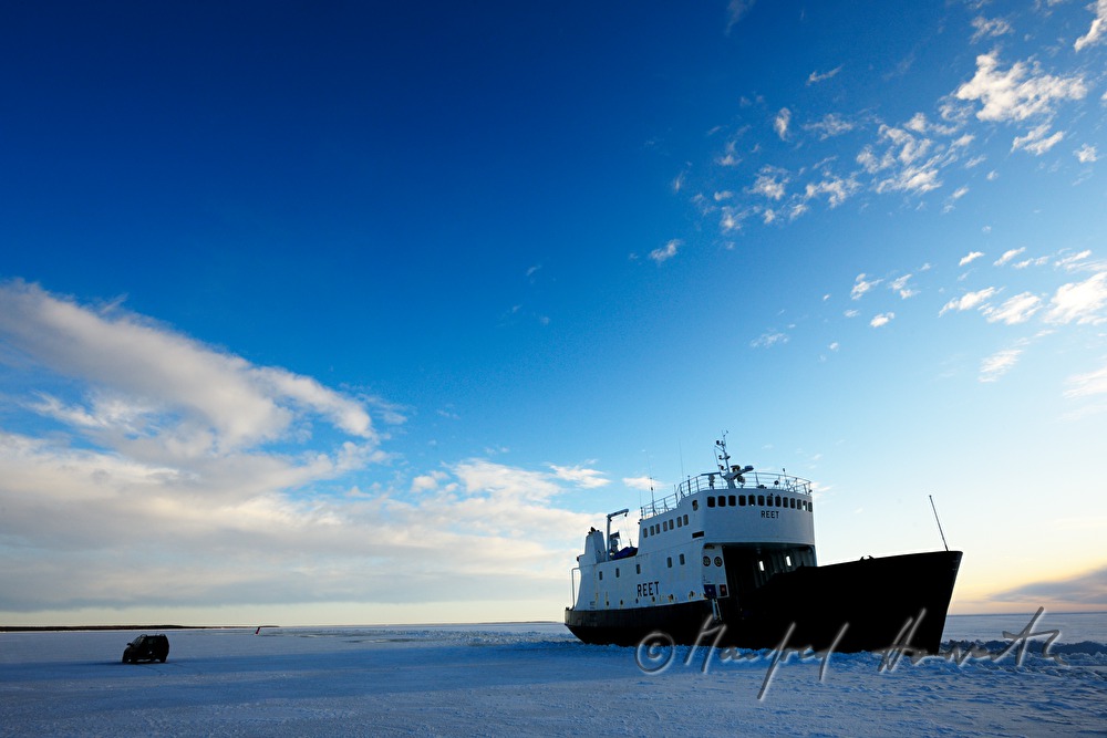 car and ice breaker on the ice road