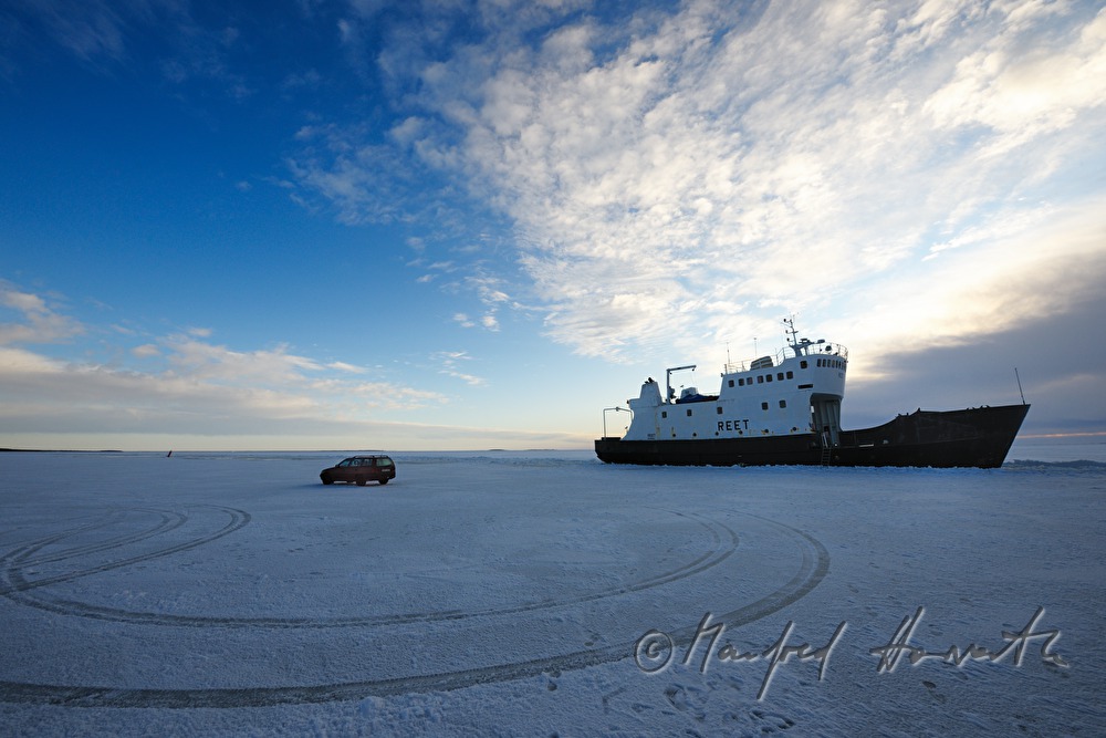 car and ice breaker on the ice road