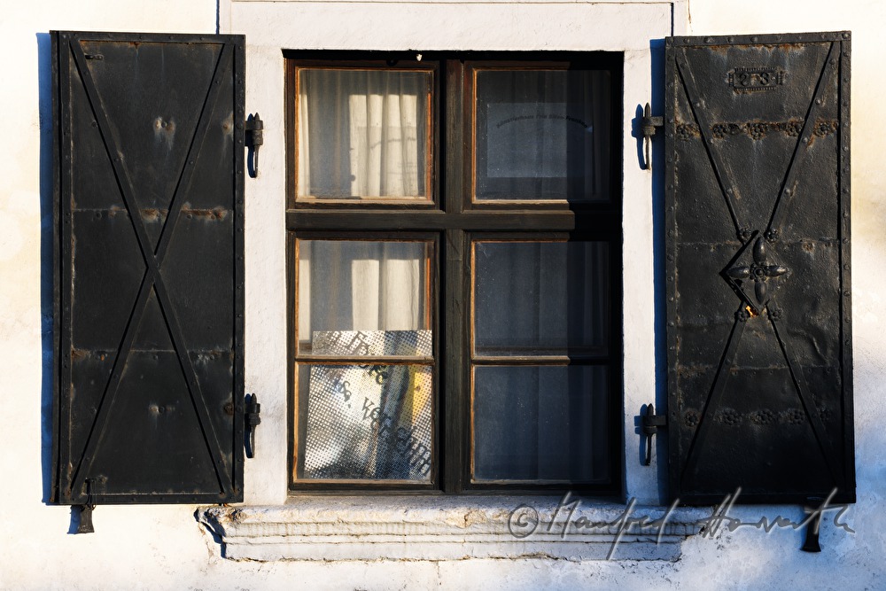 sandfilled windows of the artist's workshop