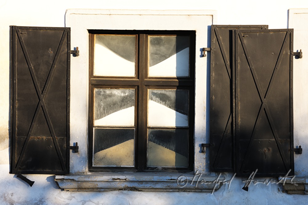 sandfilled windows of the artist's workshop