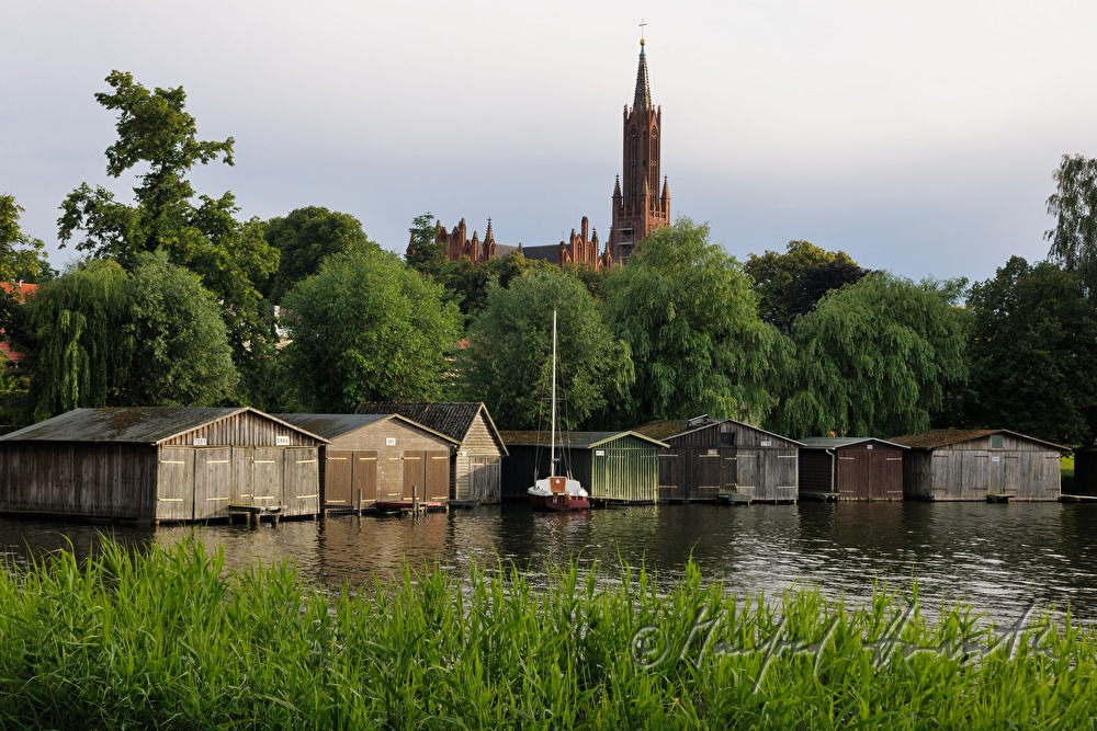 abbey church and boat houses on Malchow Lake