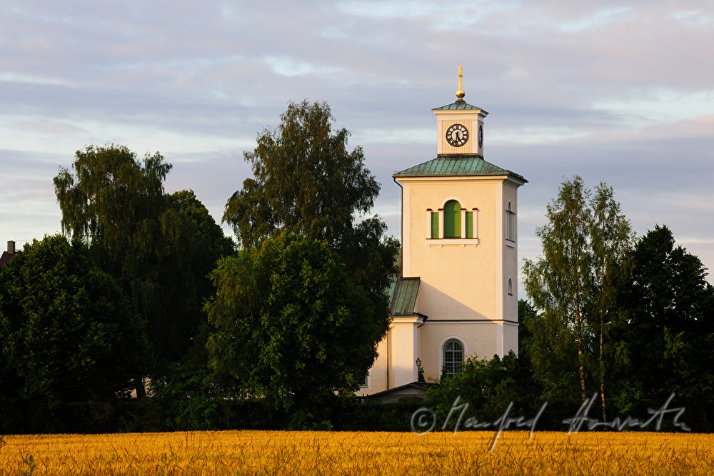 wooden church and crop field