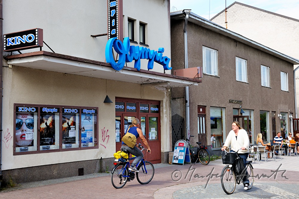 pedestrians in front of a grocery store