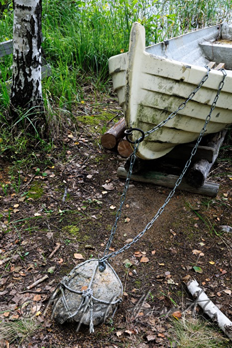 stone and anchored rowing boat