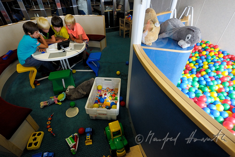 children watch TV in the play room of the car ferry