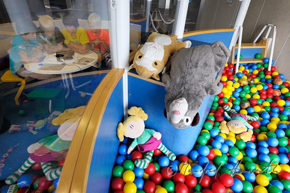 children watch TV in the play room of the car ferry