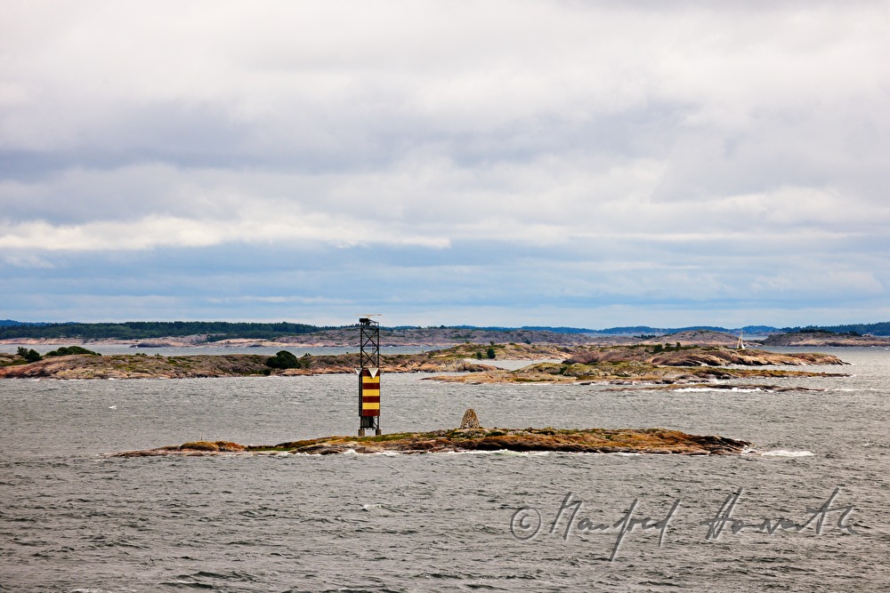 small islet with a light tower