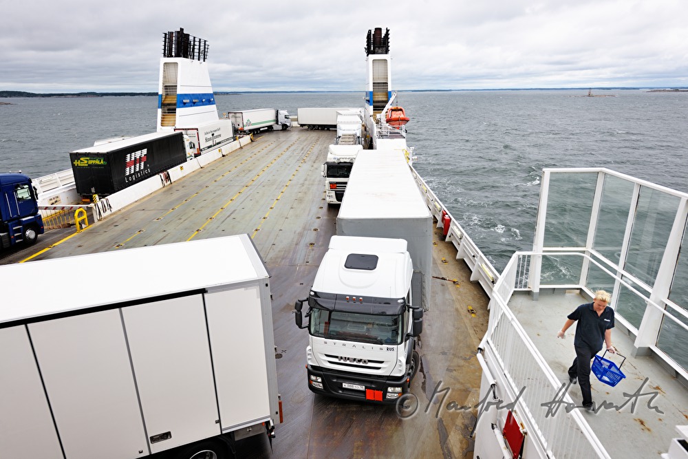 trucks on the parking lot of the car ferry