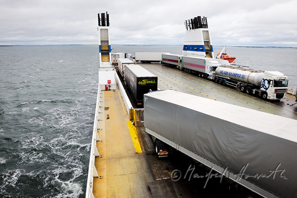 trucks on the parking lot of the car ferry