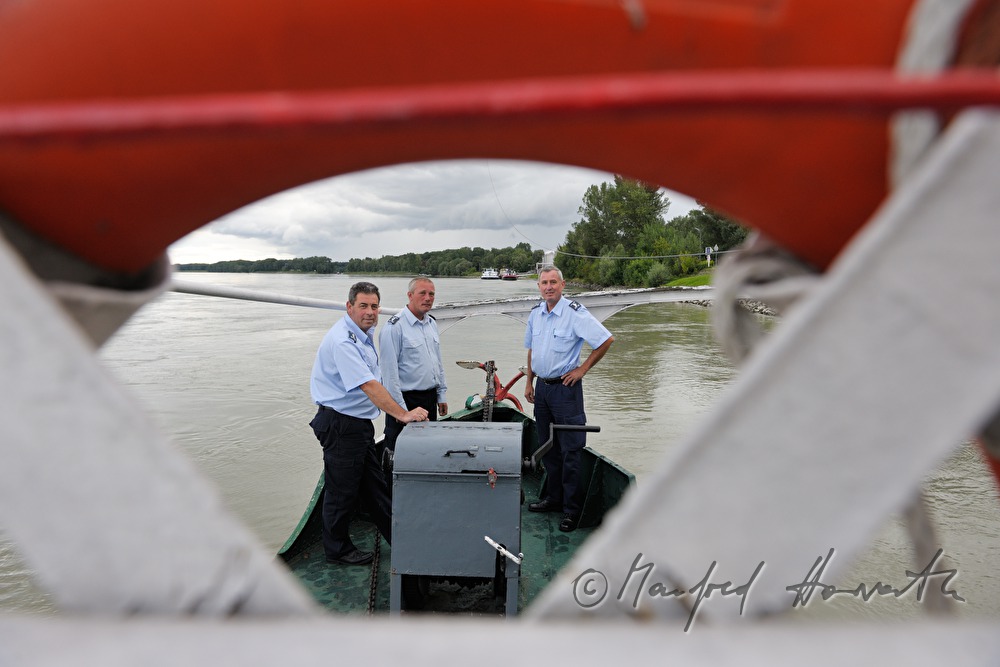 sailors at the bow of the ferry