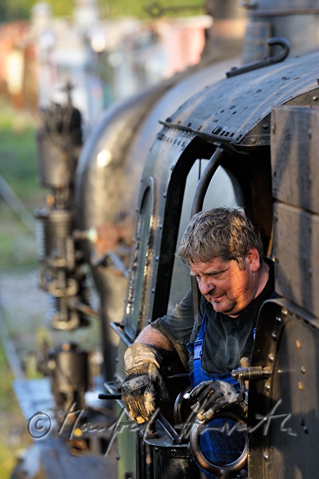 engine driver on the footplate of his steam locomotive