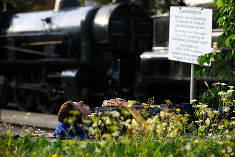 train operator rests at the trainstation