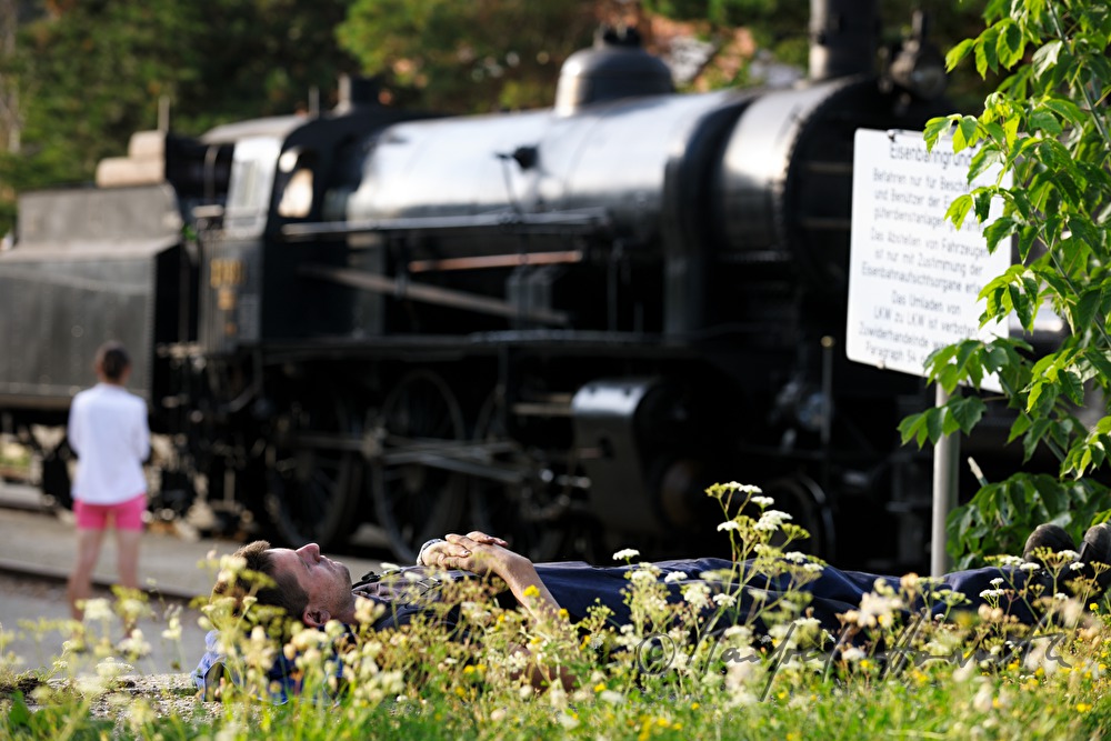 train operator rests at the trainstation