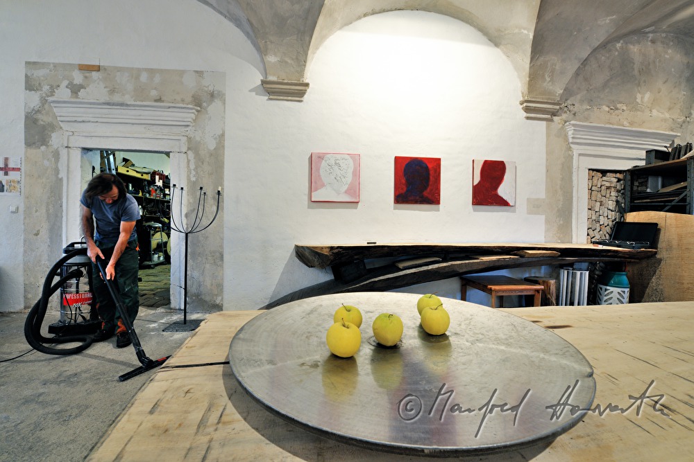 sculpturer Johann Feilacher hoovering the living room