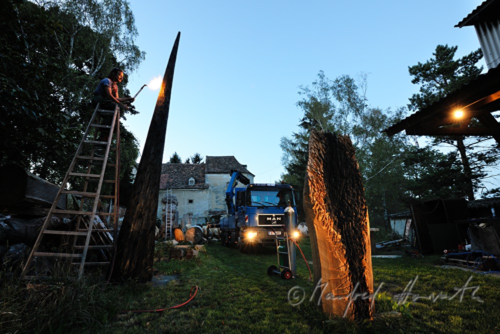 sculptor Johann Feilacher working a sculpture