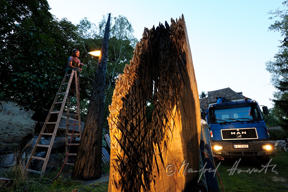 sculptor Johann Feilacher working a sculpture