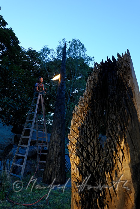 sculptor Johann Feilacher working a sculpture