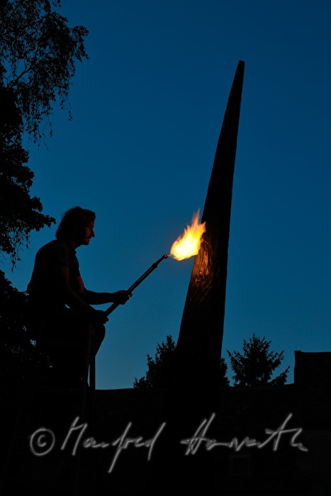 sculptor Johann Feilacher working a sculpture