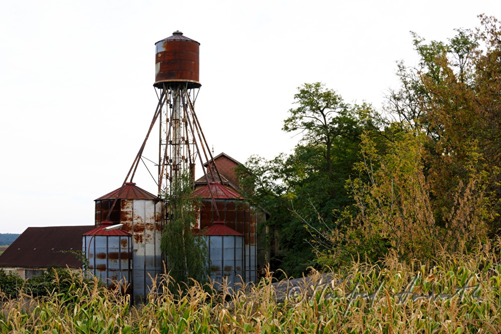 farm with silo made of corrugated sheet metal