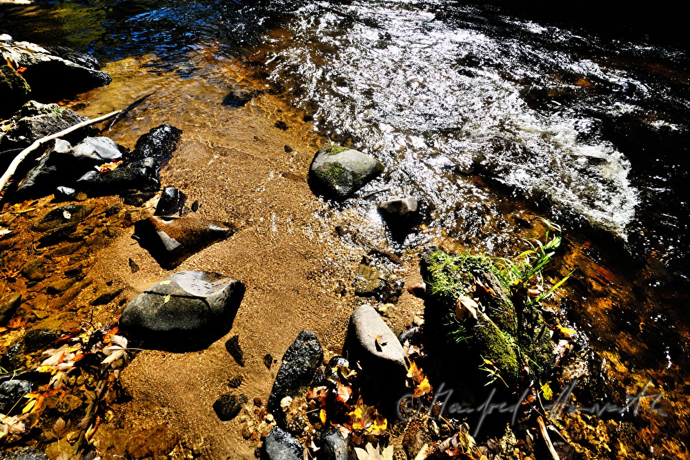 red sand containing iron on the rivershore