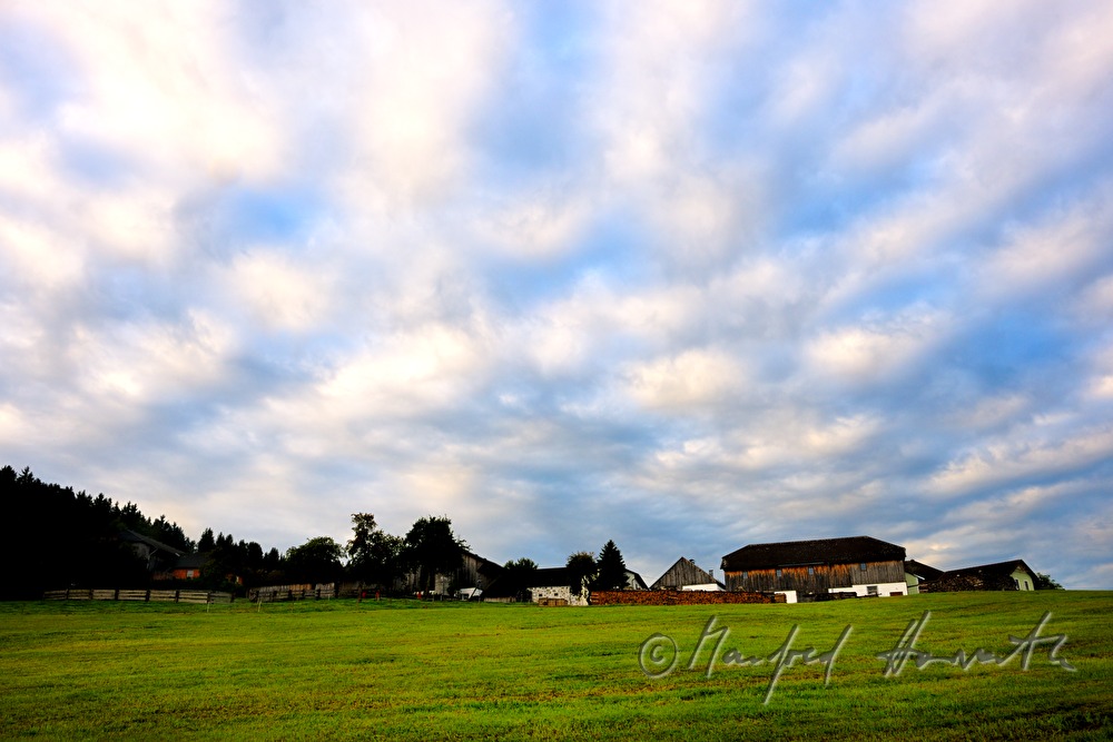farm house on the ridge of a hill