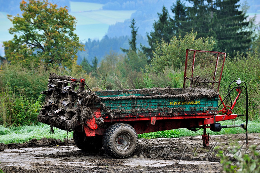 soiled trailer of a tractor parking in the field