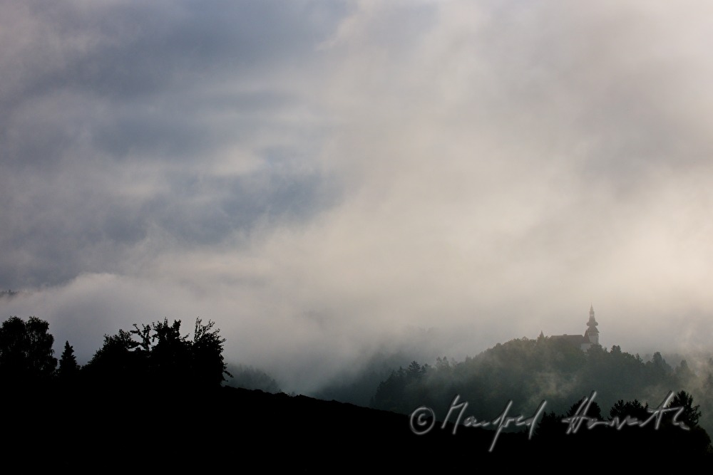 castle Weinberg in the morning mist