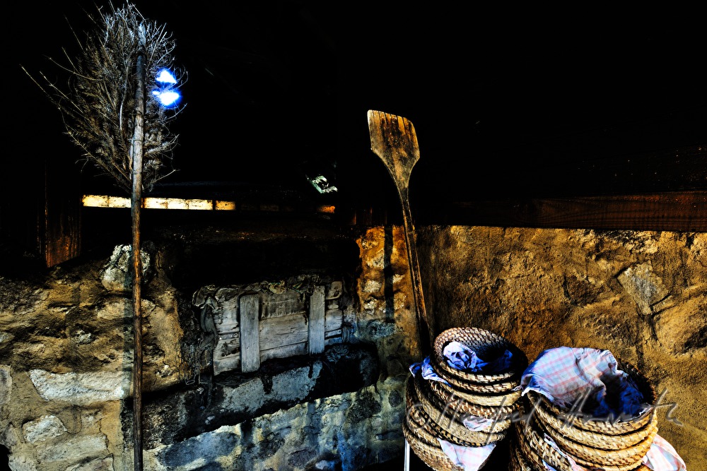 baking bread in the wood fired oven in the bakehouse