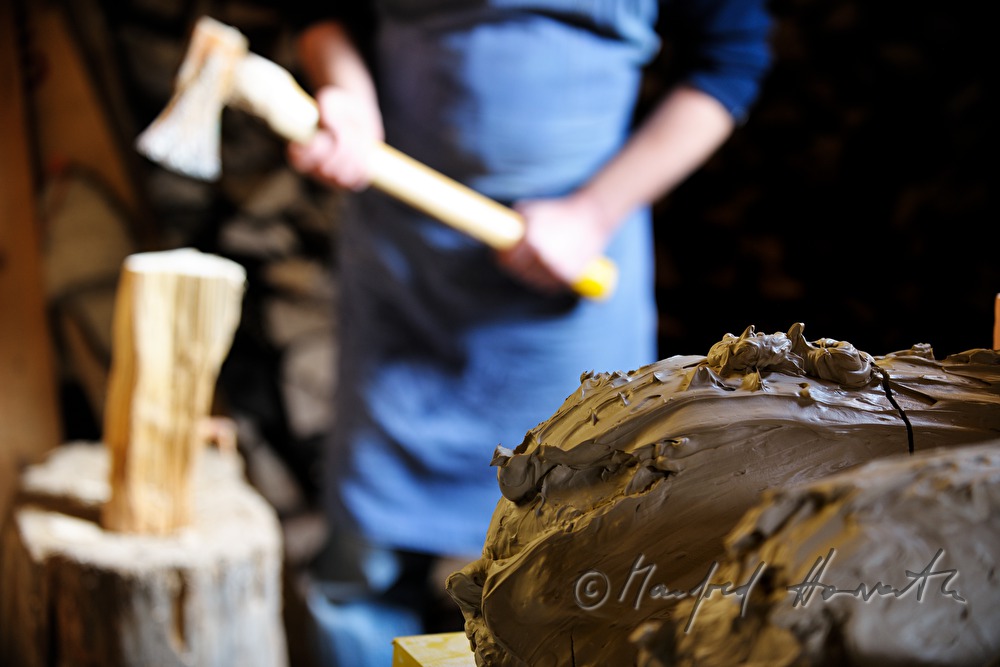 ceramist Josef Wieser chops wood