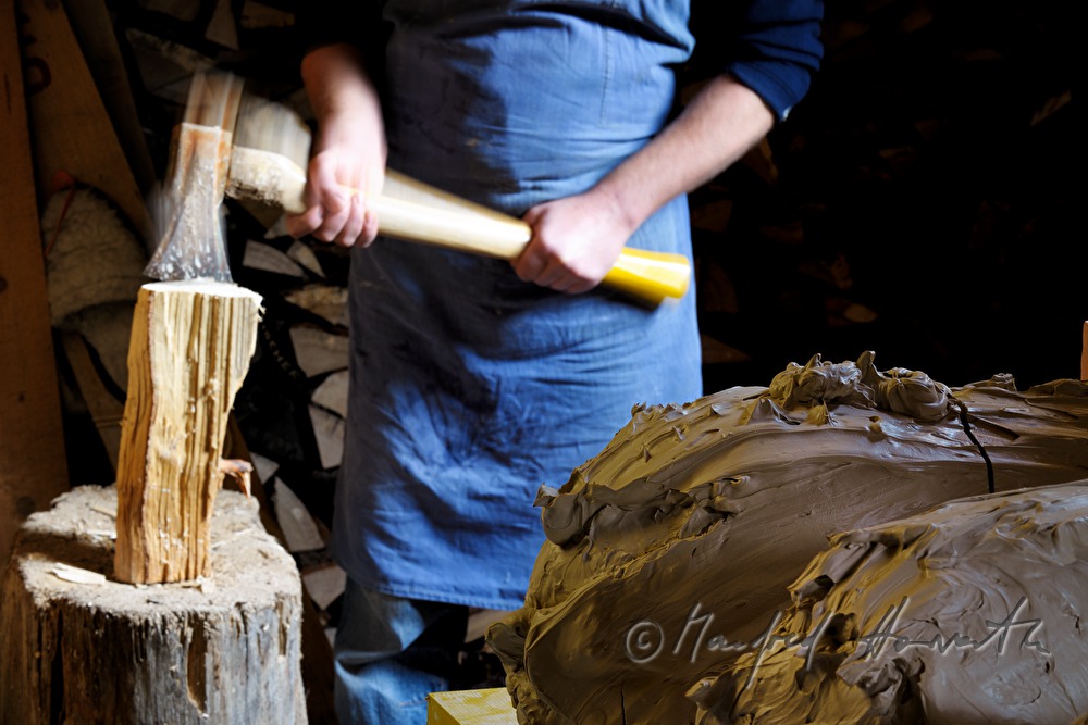ceramist Josef Wieser chops wood