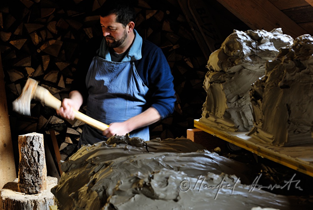 ceramist Josef Wieser chops wood
