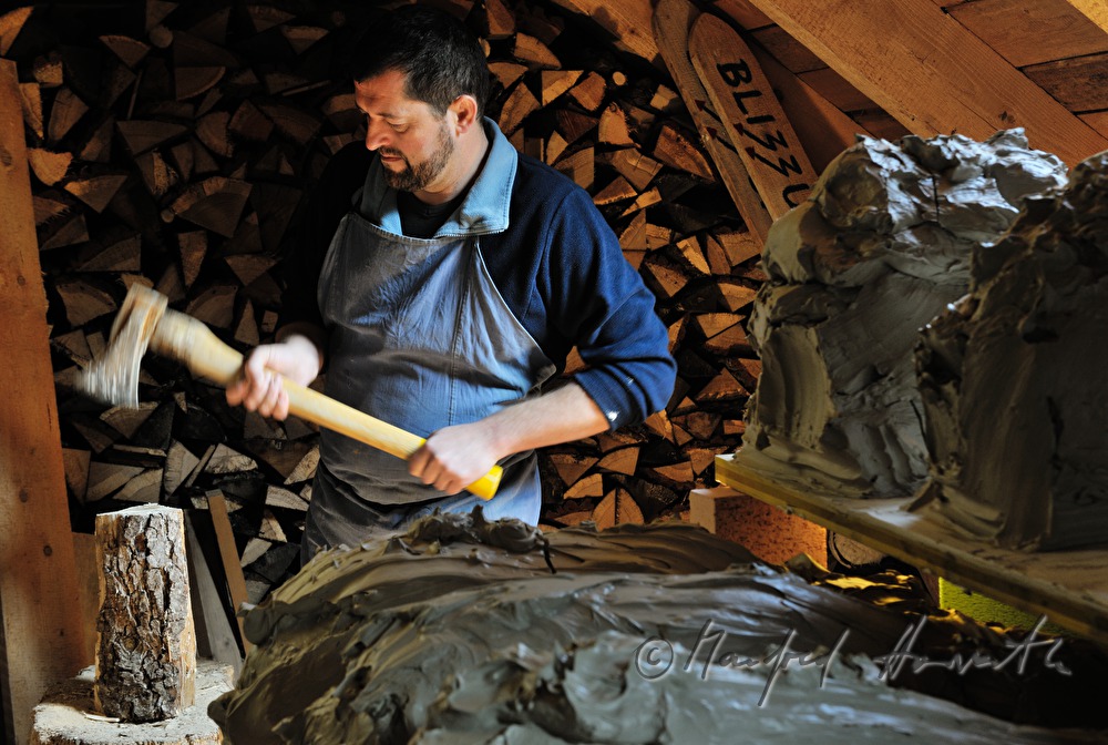 ceramist Josef Wieser chops wood