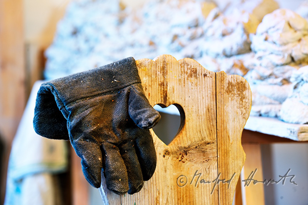 fireproof gloves on a chair in the workshop