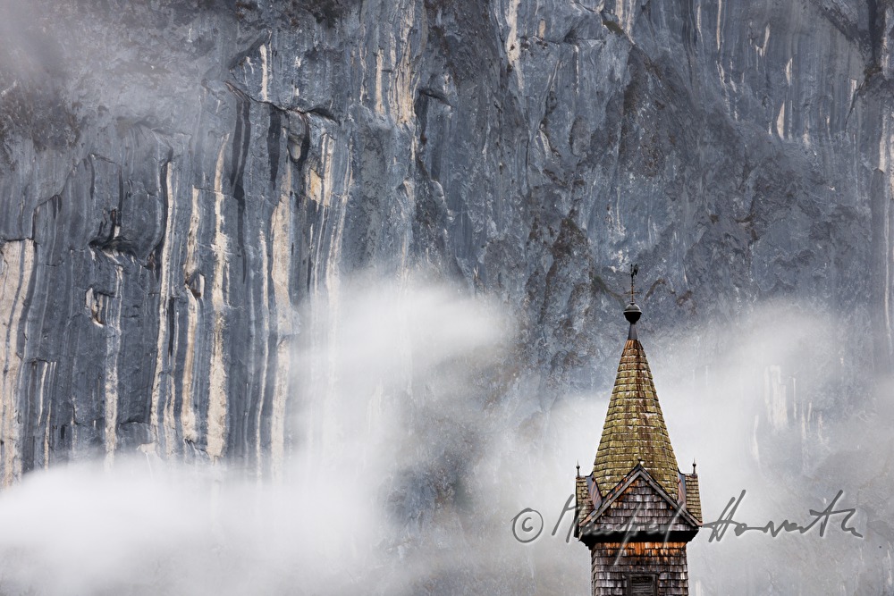 shingle made church of Gössl and fog in the mountains