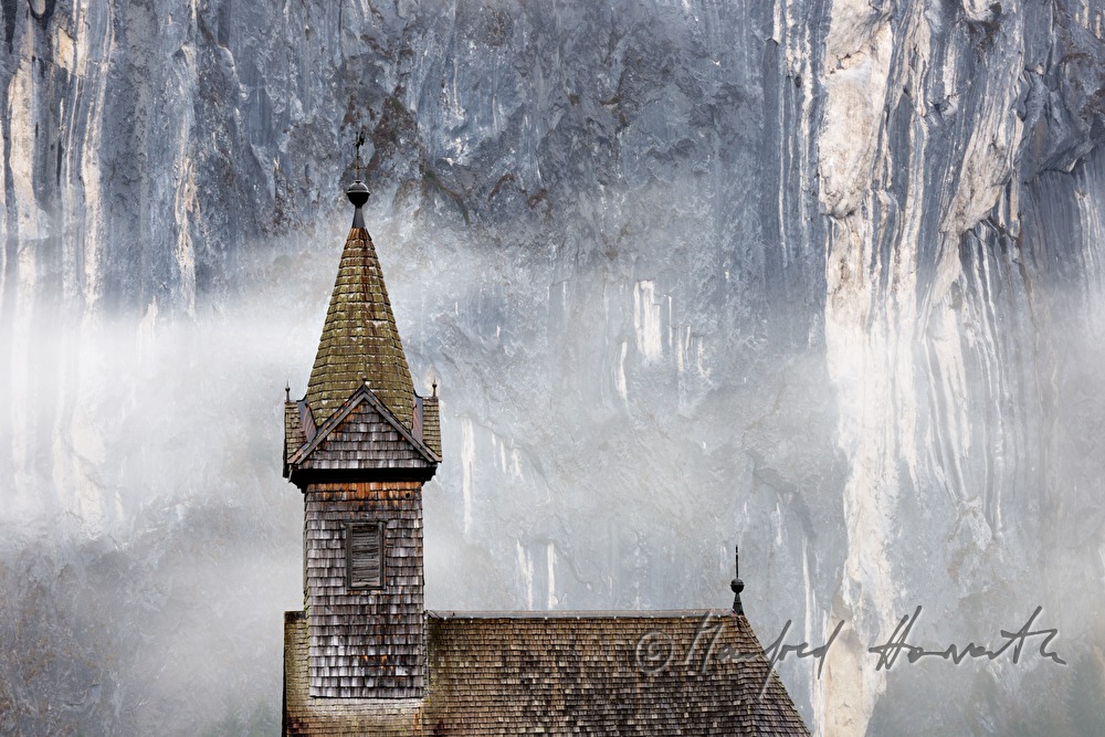 shingle made church of Gössl and fog in the mountains