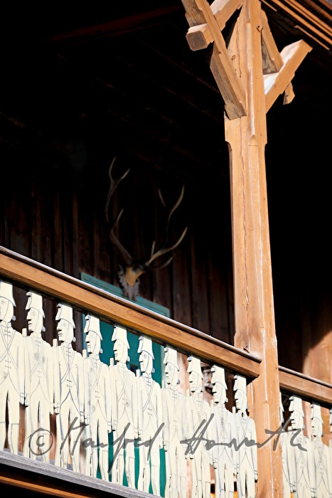 fence of a farm house with soldiers