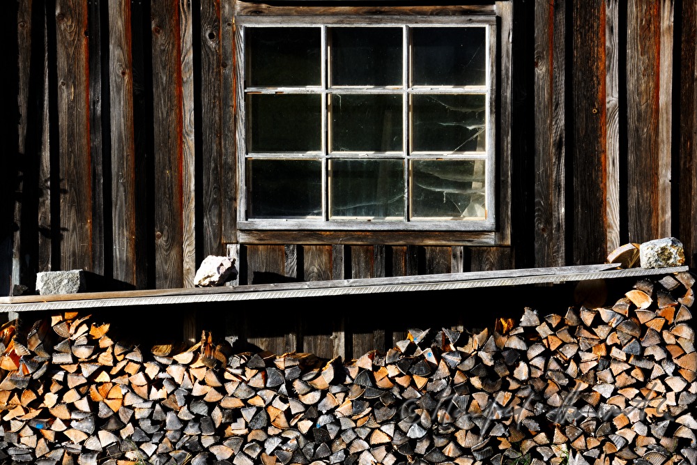 firewood stacked in a barn