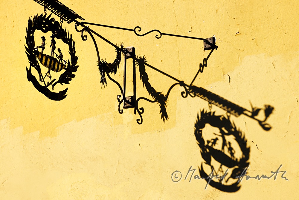 iron guild symbol on the fassade of the toll house