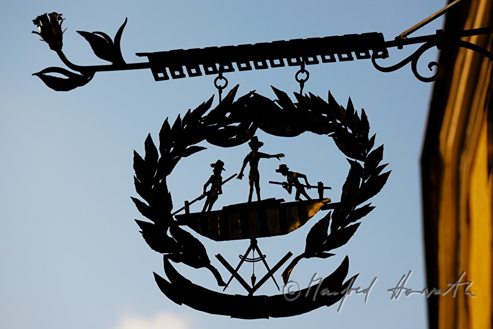 iron guild symbol on the fassade of the toll house