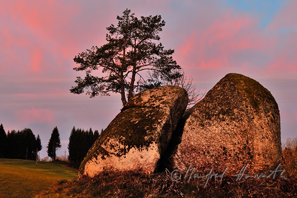 erratic block made of granite and rose sky