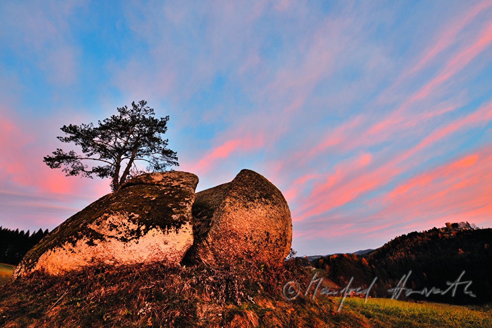 erratic block made of granite and rose sky