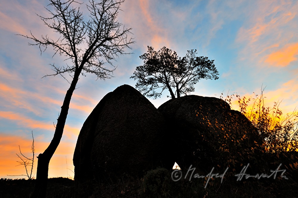 erratic block made of granite and rose sky