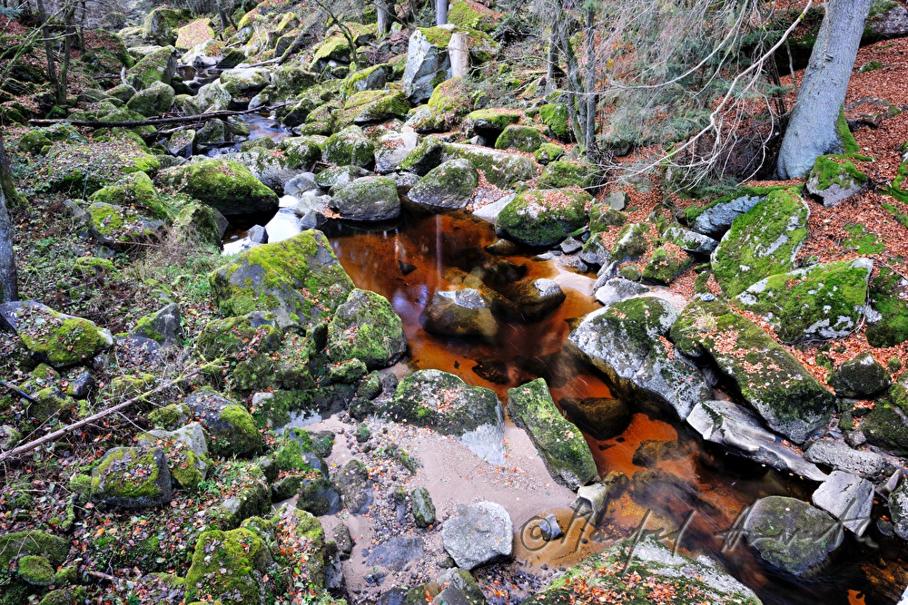red sand containing iron on the rivershore