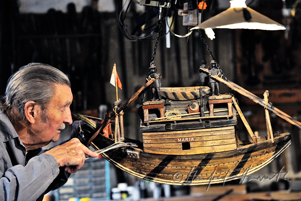 ship scale model maker Kurt Schaefer in his workshop