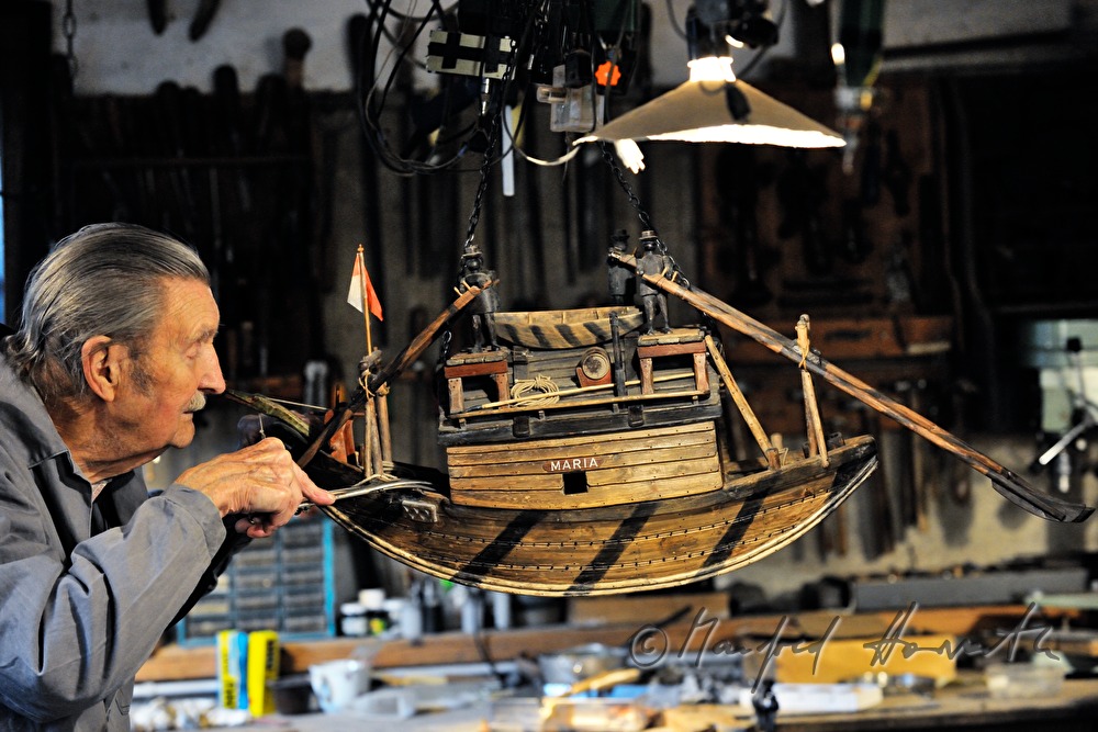 ship scale model maker Kurt Schaefer in his workshop