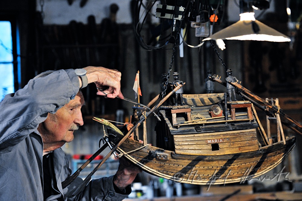 ship scale model maker Kurt Schaefer in his workshop