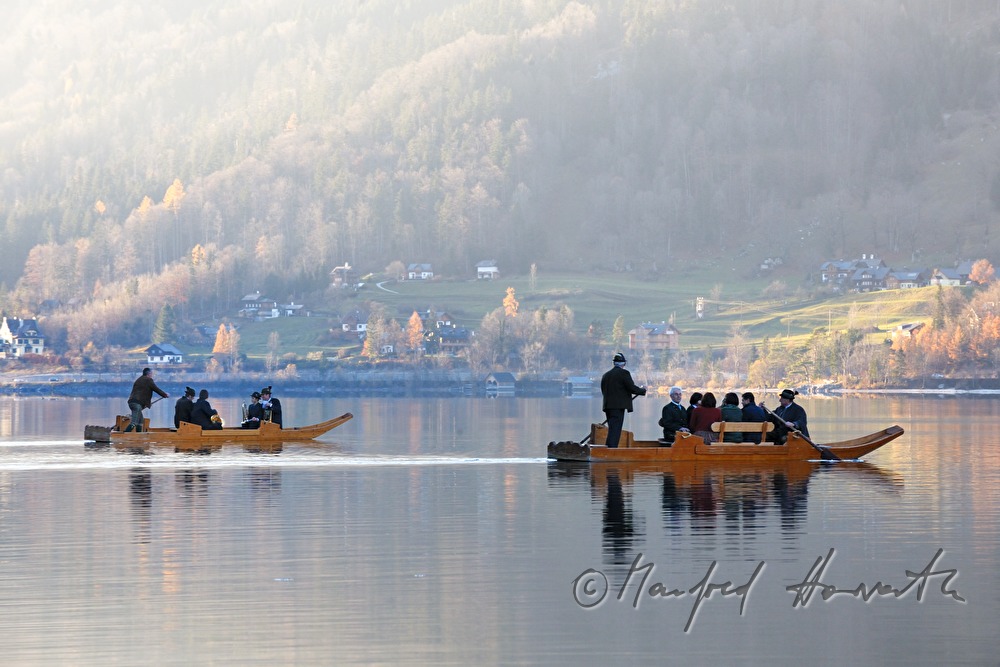 flat-bottomed boats in the backlight