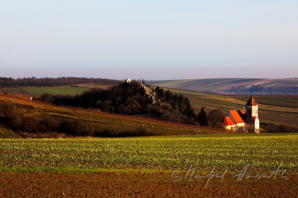 church with calvary and field