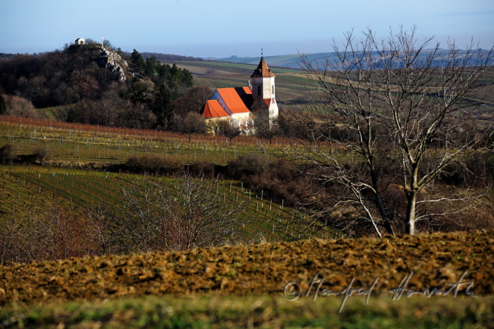 church with calvary and field