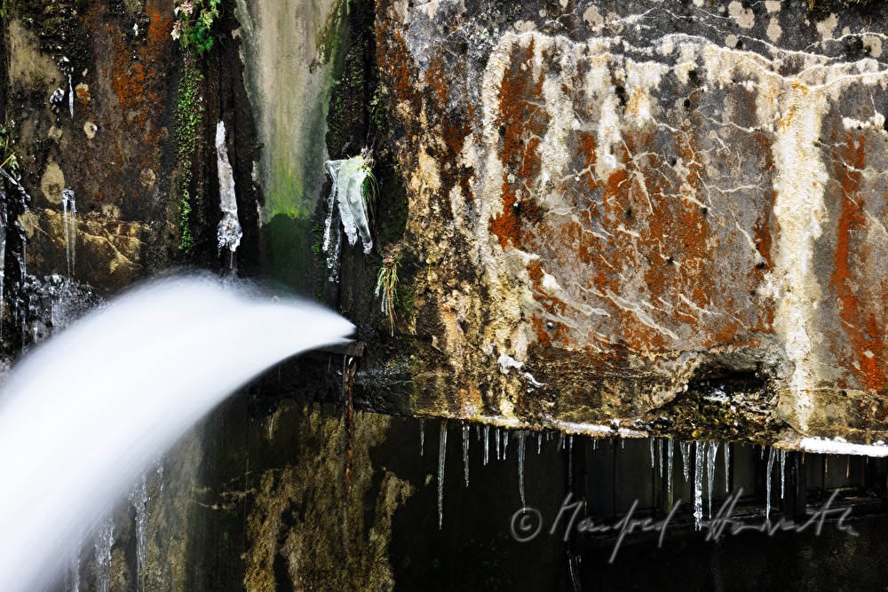 waterjet and dam near an old water mill